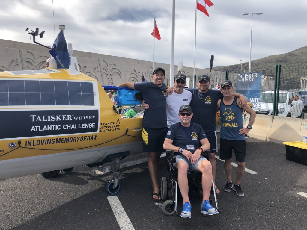The Row4ALS team in front of the boat. From left Teddy, Tim, Brian, Dale, and Alan in the front. 